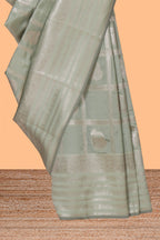Pale green checked zari motifs art silk saree with self zari border and matching zari motifs blouse