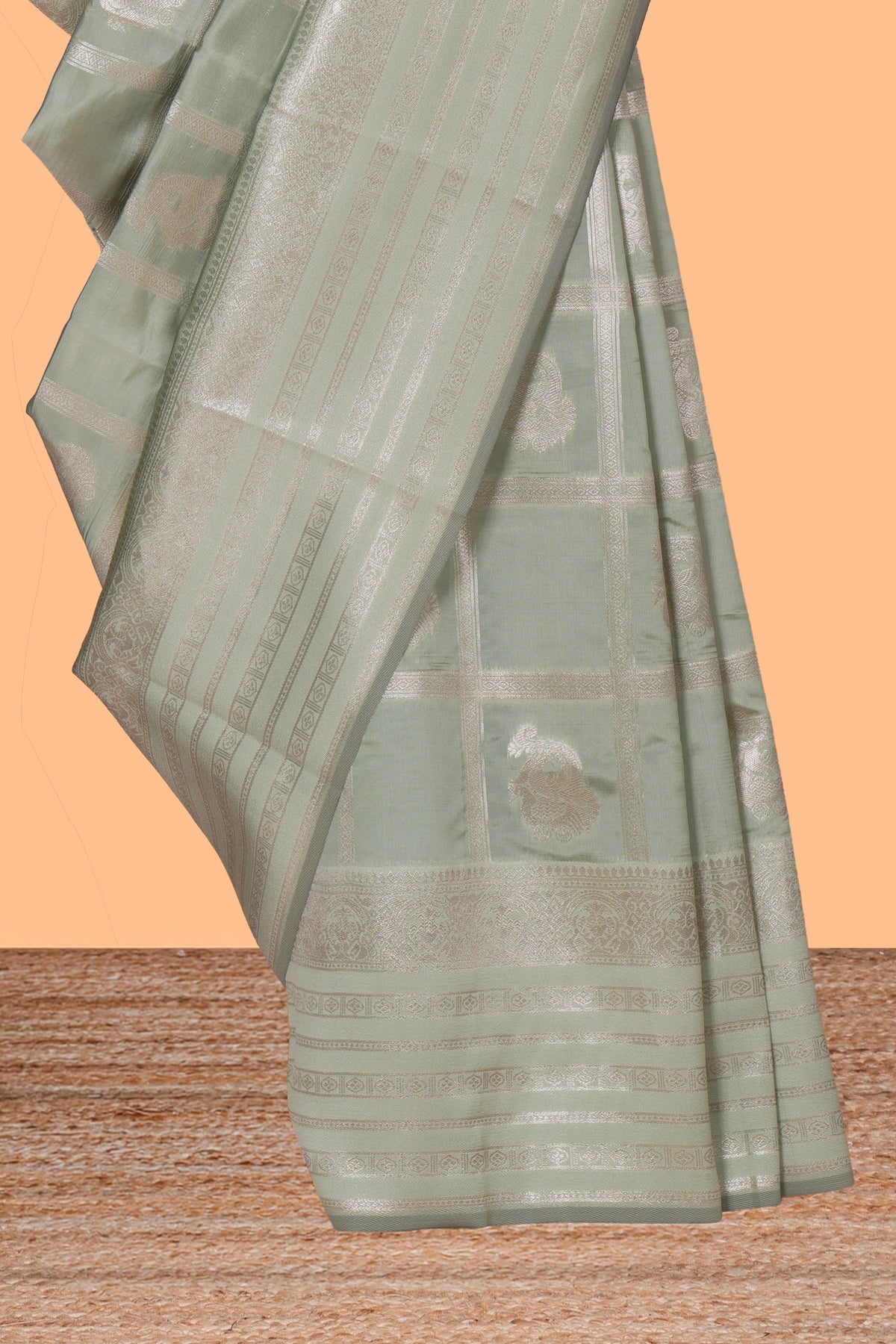 Pale green checked zari motifs art silk saree with self zari border and matching zari motifs blouse