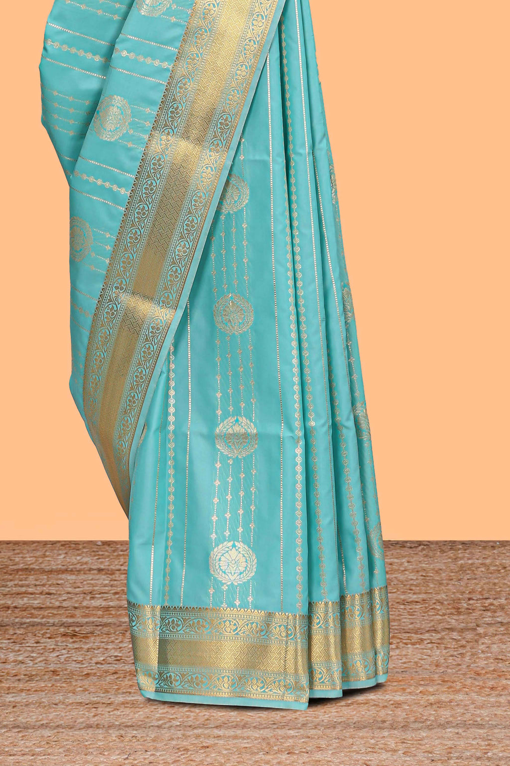 Turquoise green striped zari motifs art silk saree with self zari border and matching blouse