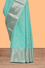 Turquoise green zari motifs art silk saree with self zari border and matching blouse