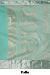 Turquoise green zari motifs art silk saree with self zari border and matching blouse