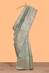 Pista green zari floral motifs art silk saree with self zari border and matching motifs blouse