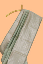 Pista green zari floral motifs art silk saree with self zari border and matching motifs blouse