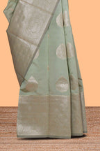 Pista green zari floral motifs art silk saree with self zari border and matching motifs blouse