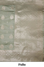 Pista green zari floral motifs art silk saree with self zari border and matching motifs blouse
