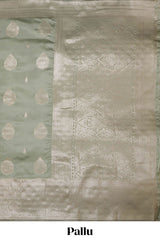 Pista green zari floral motifs art silk saree with self zari border and matching motifs blouse