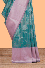 Teal green striped floral design art silk saree with contrast zari border and zari motifs blouse