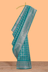 Teal green checked floral motifs design art silk saree with self zari border and matching motifs blouse