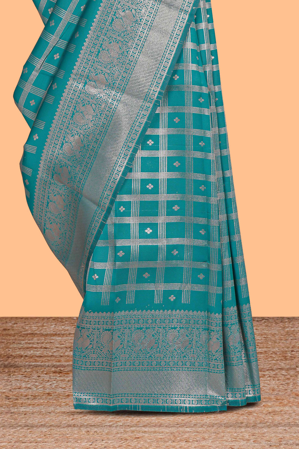 Teal green checked floral motifs design art silk saree with self zari border and matching motifs blouse