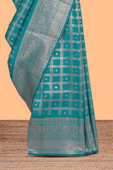 Teal green checked floral motifs design art silk saree with self zari border and matching motifs blouse