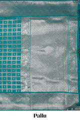 Teal green checked floral motifs design art silk saree with self zari border and matching motifs blouse