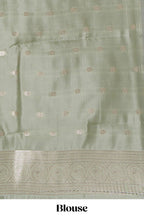 Dark brown floral motifs design art silk saree with contrast zari border and motifs blouse