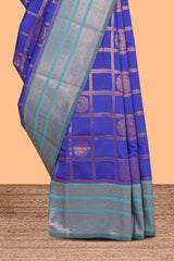 Blue checked floral motifs design art silk saree with contrast zari border and motifs blouse