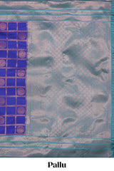 Blue checked floral motifs design art silk saree with contrast zari border and motifs blouse