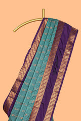 Turquoise green striped zari design art silk saree with contrast zari border and blouse