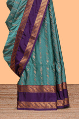 Turquoise green striped zari design art silk saree with contrast zari border and blouse