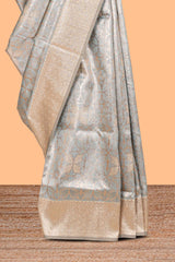 Powder bluegeometric floral design art silk saree with contrast zari border and motifs blouse