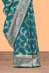 Green floral design art silk saree with self zari border and matching motifs blouse