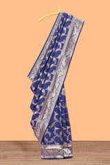 Blue floral design art silk saree with self zari border and matching motifs blouse