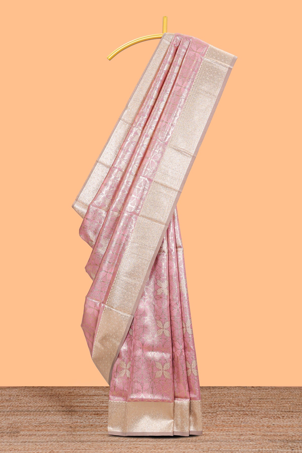 Pink geometric floral design art silk saree with contrast zari border and motifs blouse