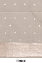 Pink geometric floral design art silk saree with contrast zari border and motifs blouse