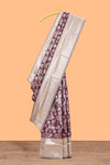 Purple floral design art silk saree with contrast zari border and motifs blouse