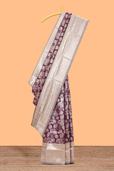 Purple floral design art silk saree with contrast zari border and motifs blouse