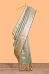 Green motifs design art silk saree with contrast zari border and motifs blouse