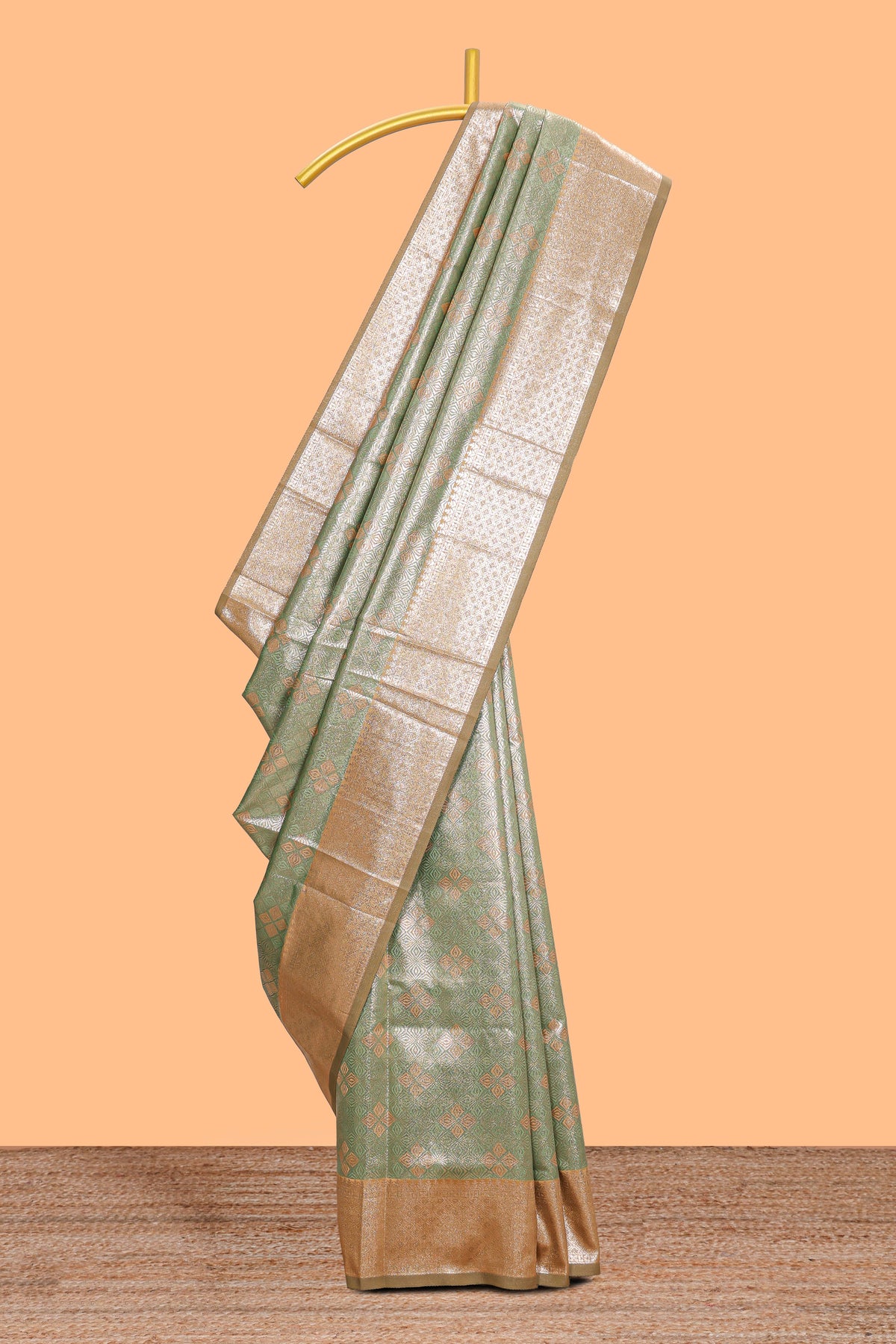 Green motifs design art silk saree with contrast zari border and motifs blouse