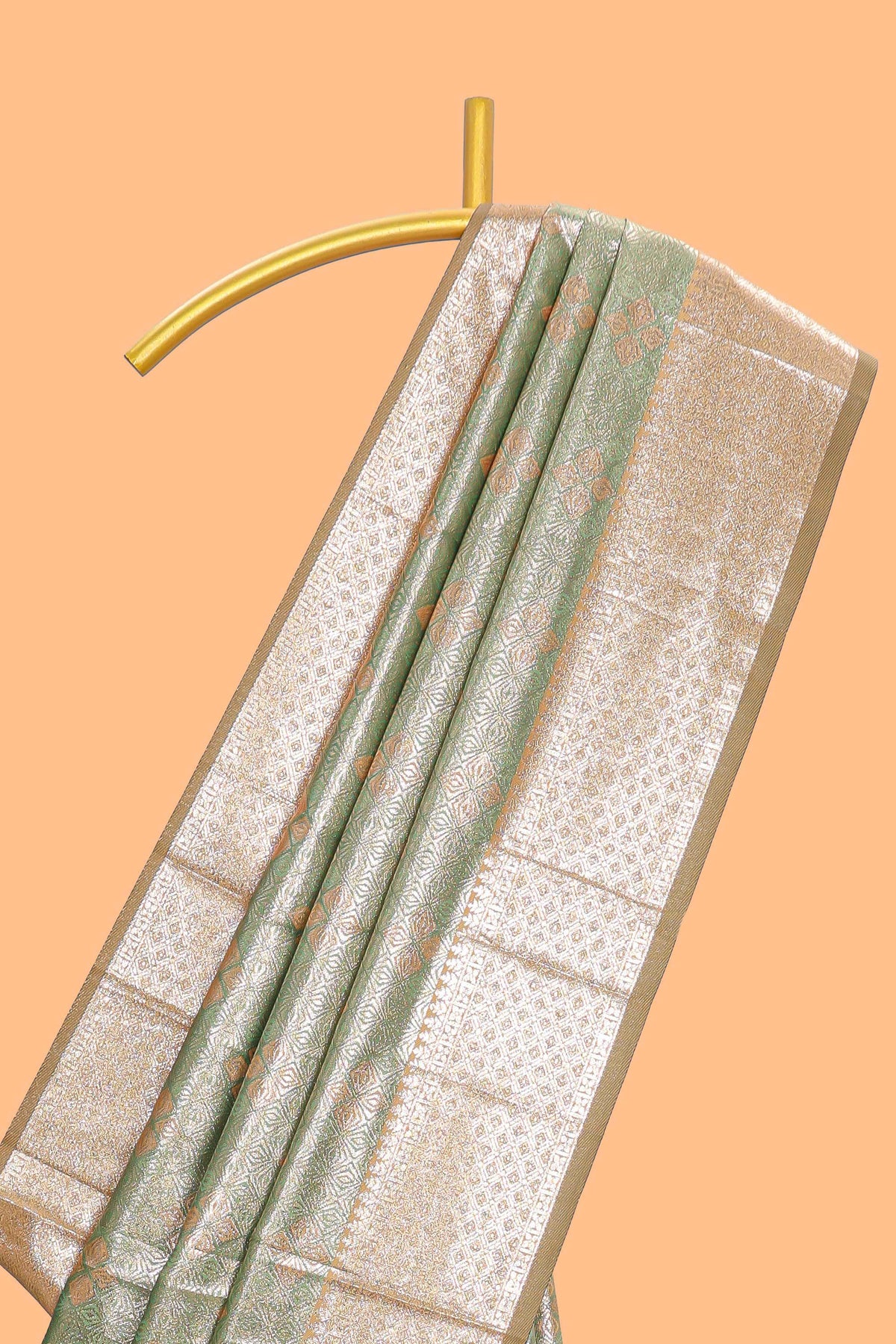 Green motifs design art silk saree with contrast zari border and motifs blouse