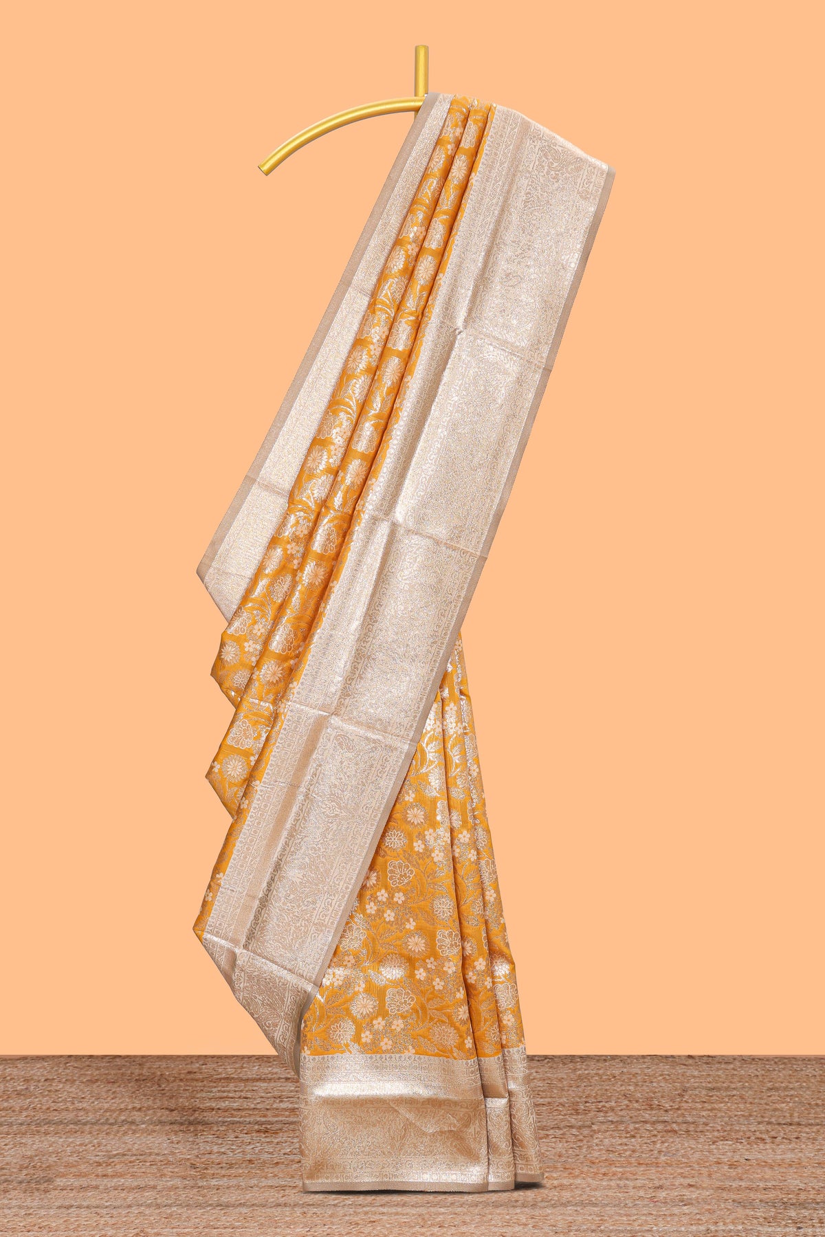 Golden yellow floral design art silk saree with contrast zari border and motifs blouse