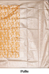 Golden yellow floral design art silk saree with contrast zari border and motifs blouse