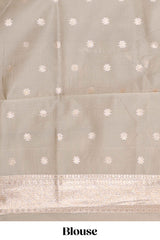 Golden yellow floral design art silk saree with contrast zari border and motifs blouse