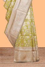 Green floral design art silk saree with contrast zari border and motifs blouse