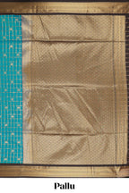 Teal blue checked art silk saree with contrast zari border and striped blouse