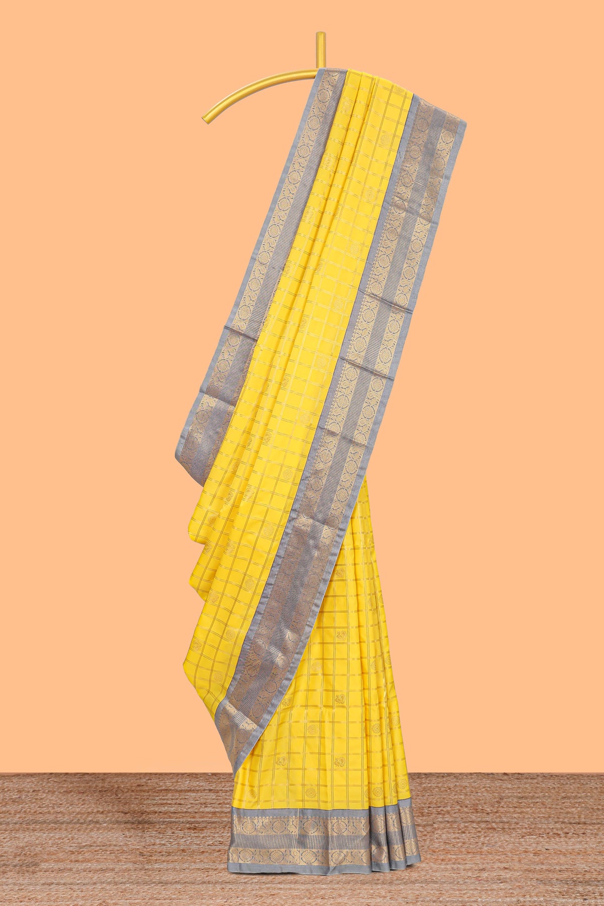 Yellow checked art silk saree with contrast zari border and blouse