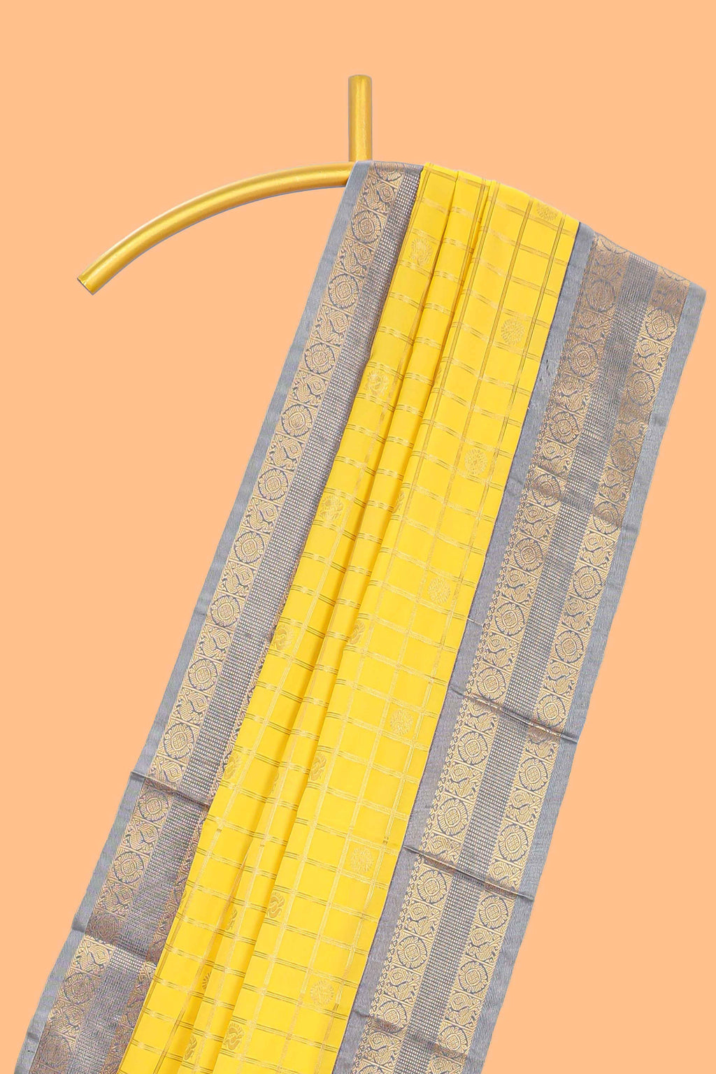 Yellow checked art silk saree with contrast zari border and blouse