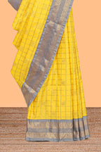 Yellow checked art silk saree with contrast zari border and blouse