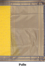 Yellow checked art silk saree with contrast zari border and blouse