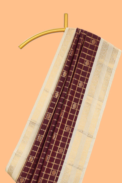 Brown checked art silk saree with contrast zari border and blouse