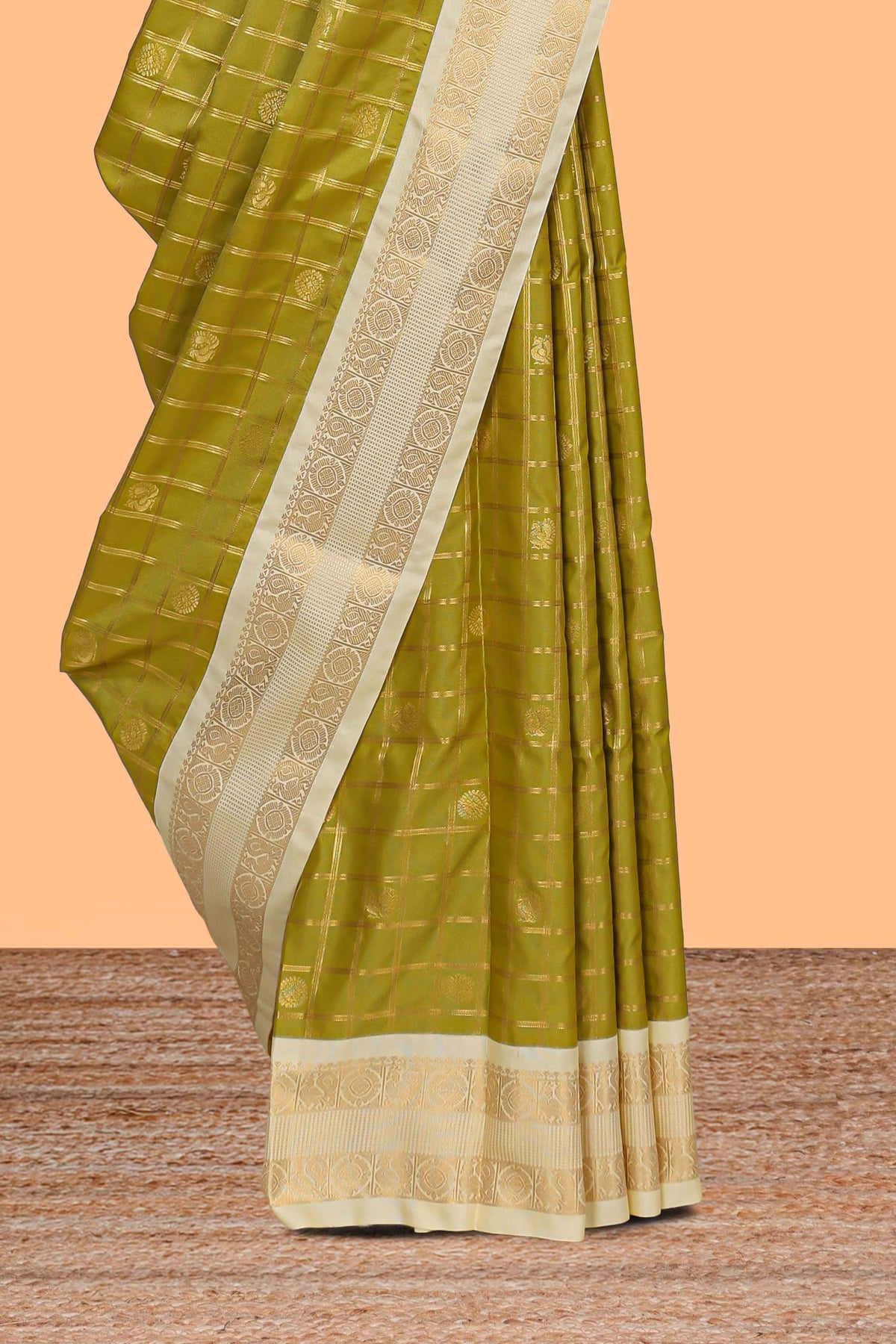 Green checked art silk saree with contrast zari border and blouse