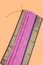 Pink checked art silk saree with contrast zari border and blouse