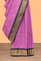 Pink checked art silk saree with contrast zari border and blouse