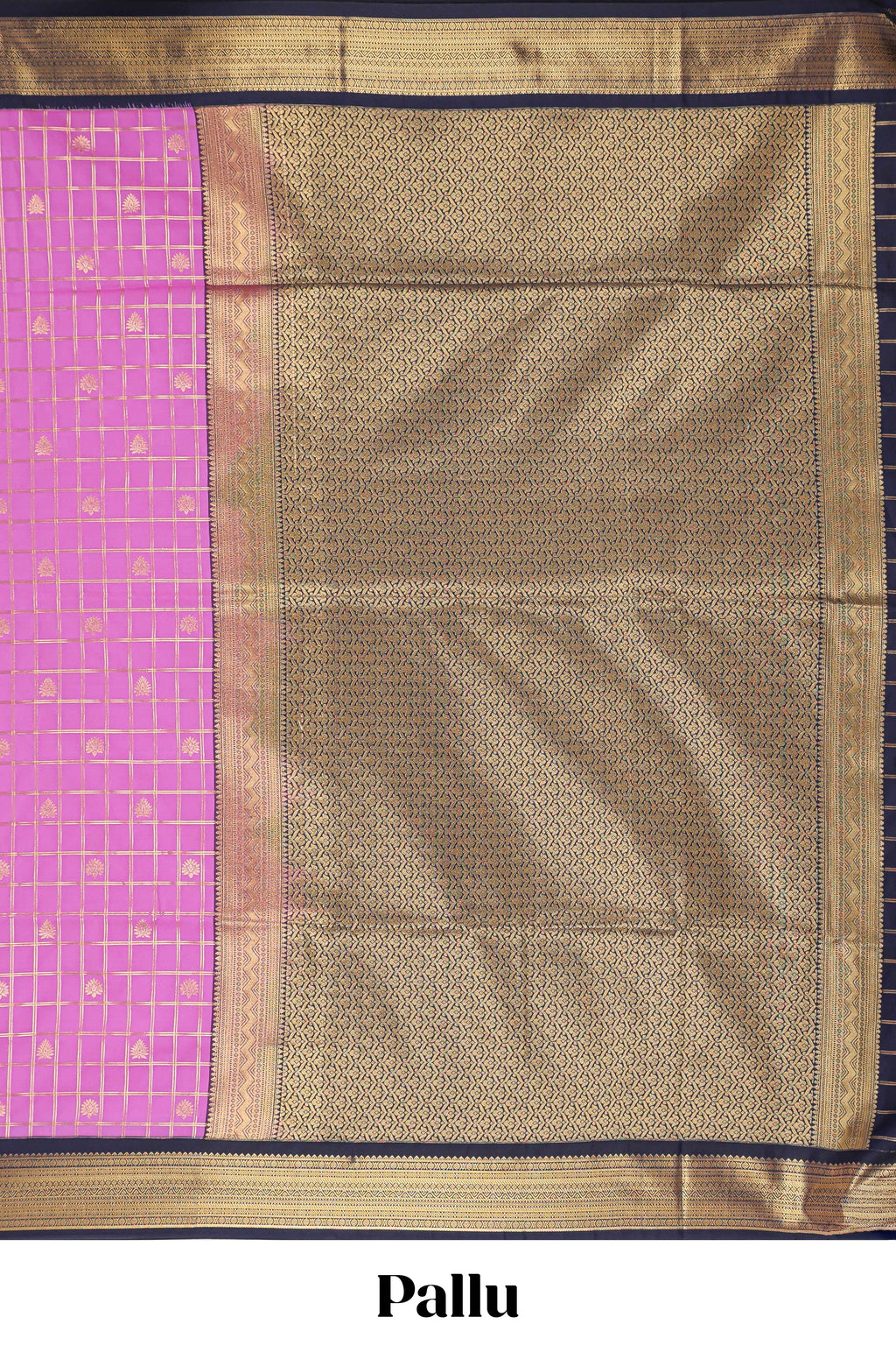 Pink checked art silk saree with contrast zari border and blouse