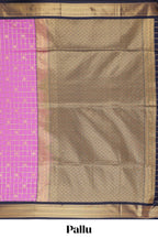 Pink checked art silk saree with contrast zari border and blouse