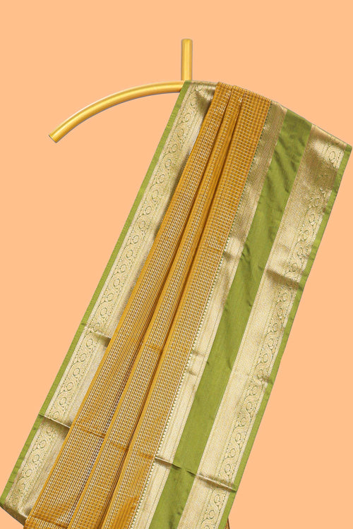 Mustard checked art silk saree with contrast zari border and blouse