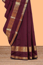 Maroon plain art silk saree with contrast self border and matching blouse