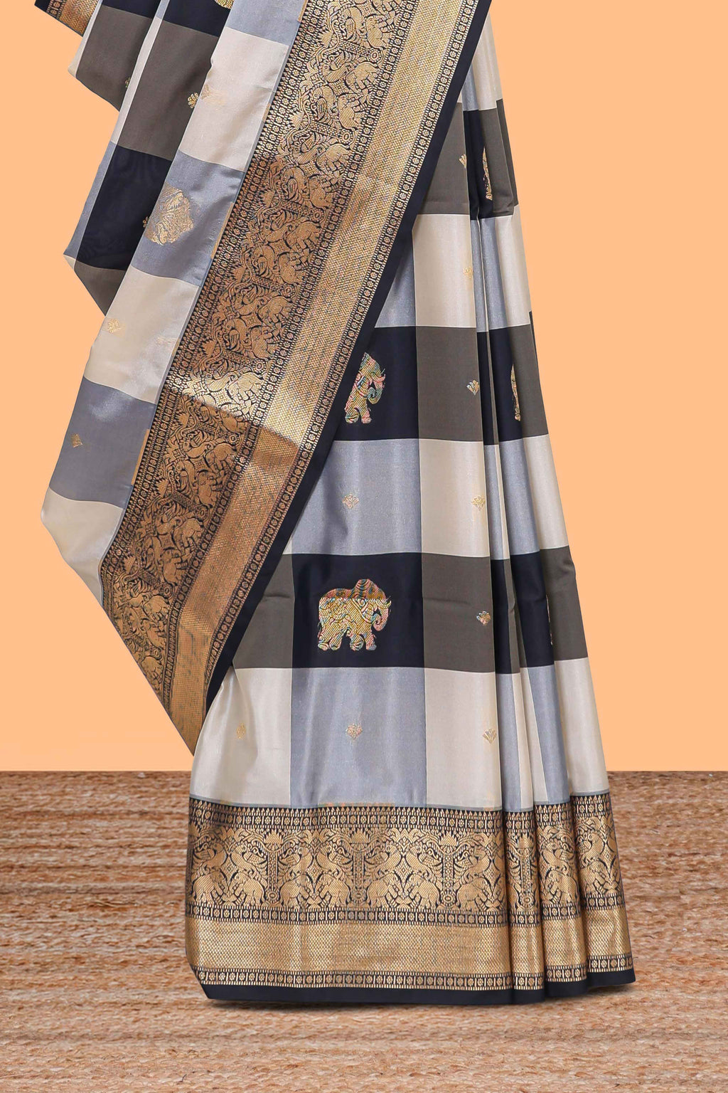 Black and white checked elephant motifs art silk saree with contrast self zari border and matching blouse