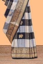 Black and white checked elephant motifs art silk saree with contrast self zari border and matching blouse