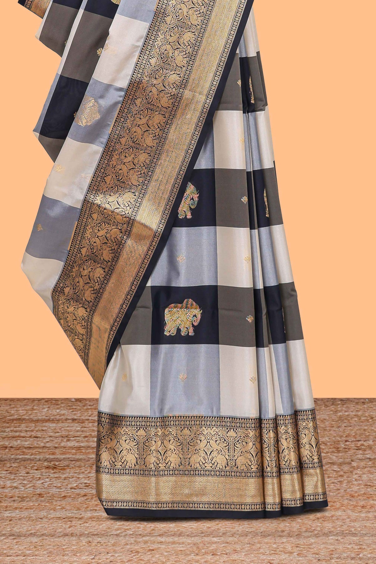 Black and white checked elephant motifs art silk saree with contrast self zari border and matching blouse